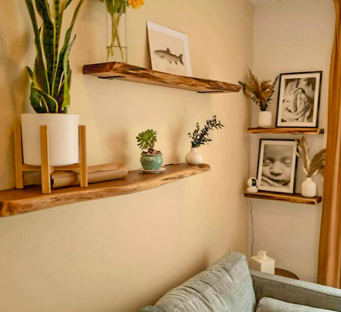 Walnut shelves above a couch Walnut shelves above a couch